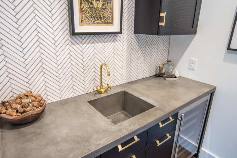 hand troweled concrete wet bar with integral sink by beton studio
