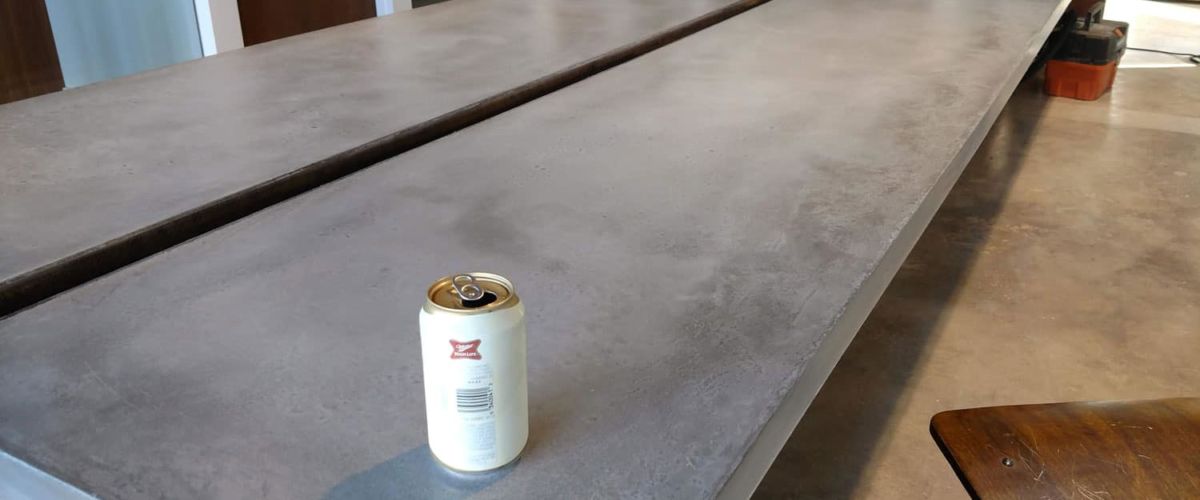 A cold beer on hand troweled concrete countertop